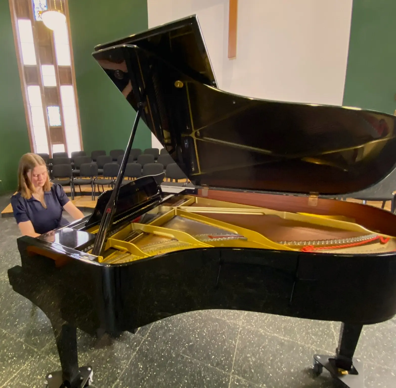 Freya Terris performing ABRSM Grade 8 piano with her left hand